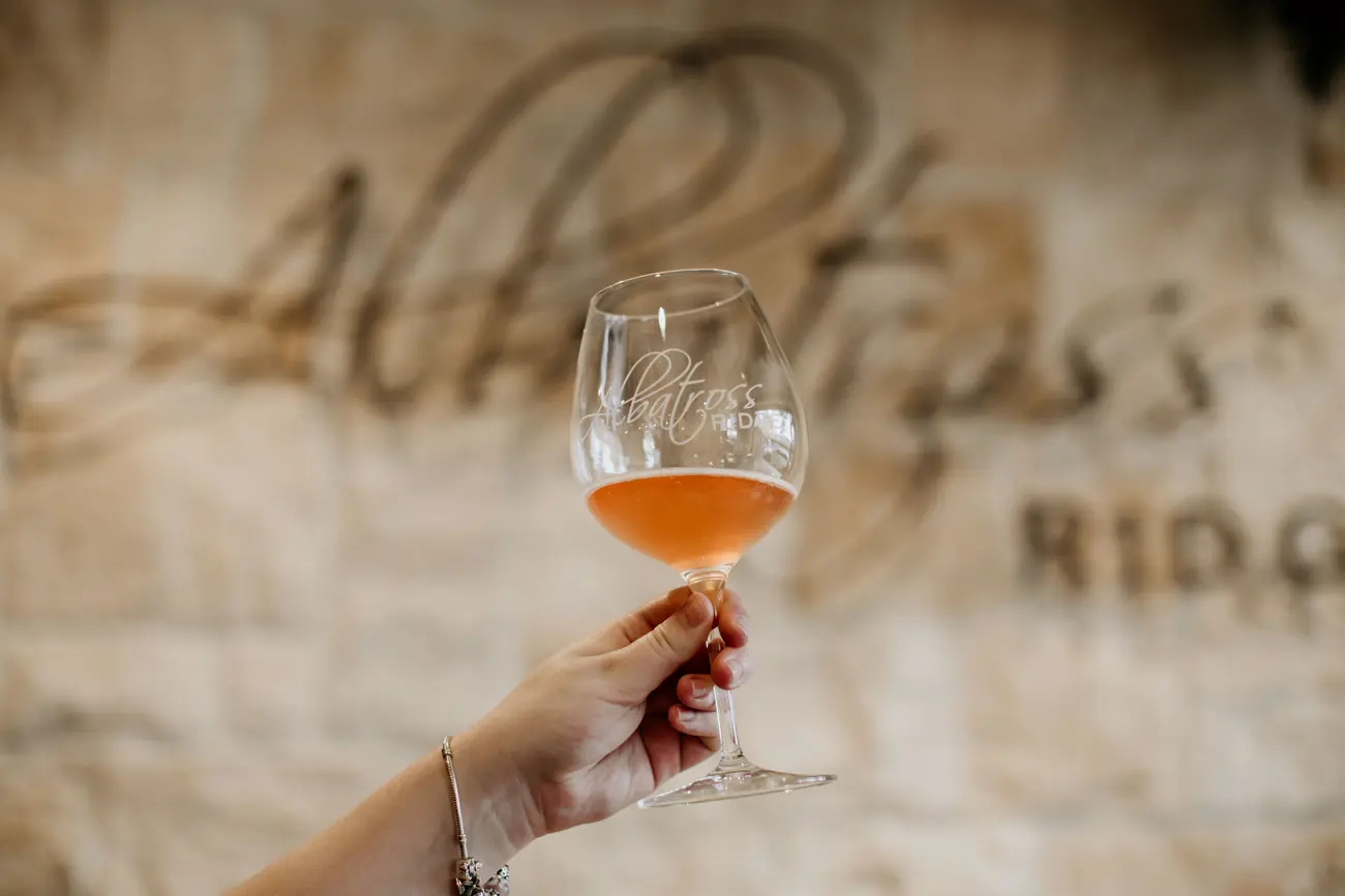 A glass of estate rosé