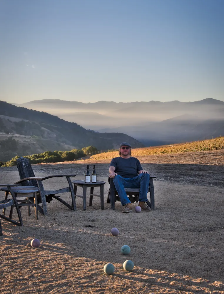 A guest seated on the ridge at sundown