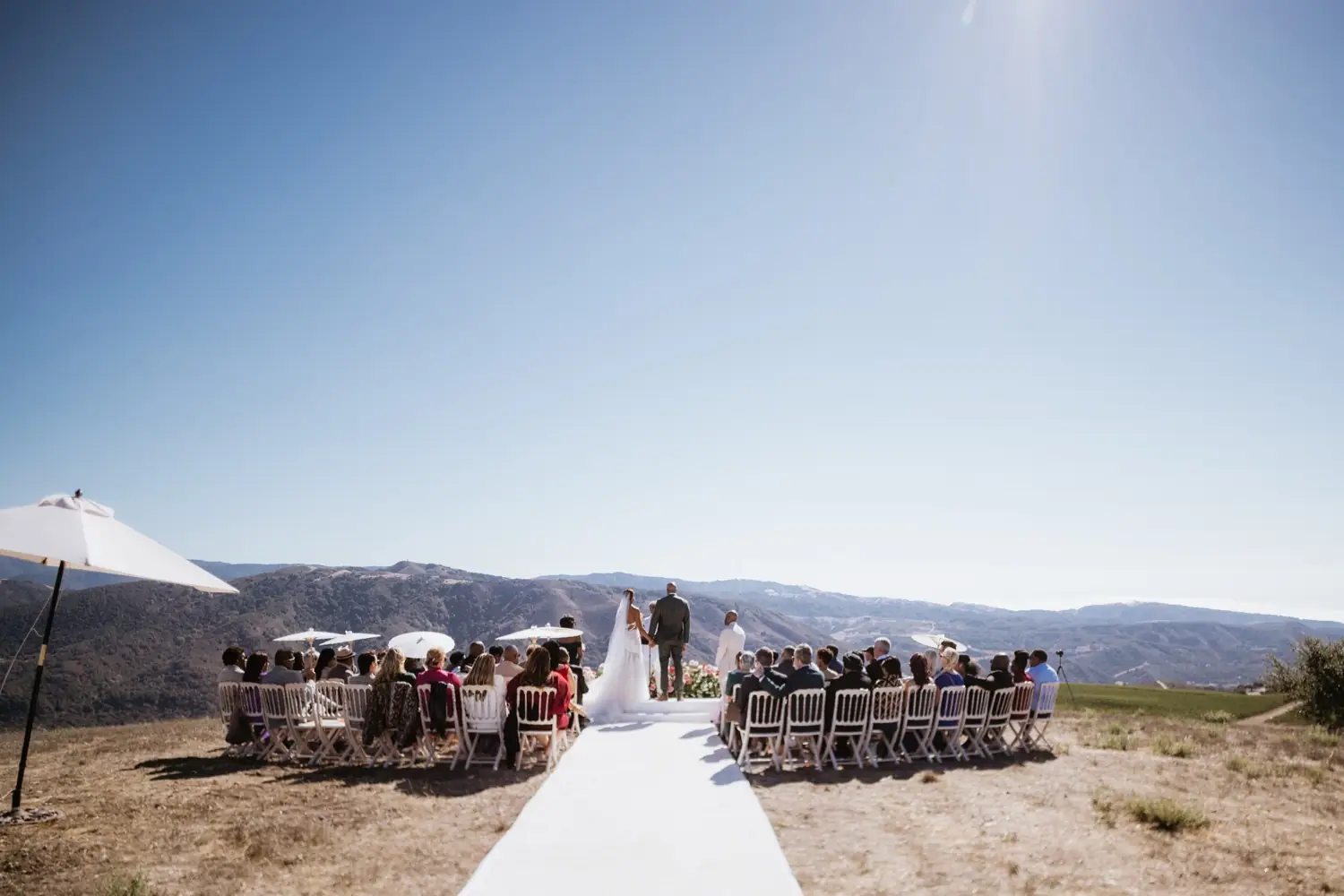 A ceremony on the ridge, the valley beyond